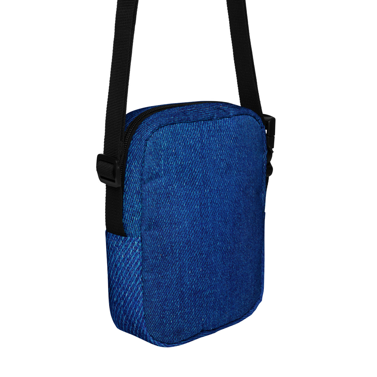 Denim crossbody bag, hanging angled view showing the rear panel