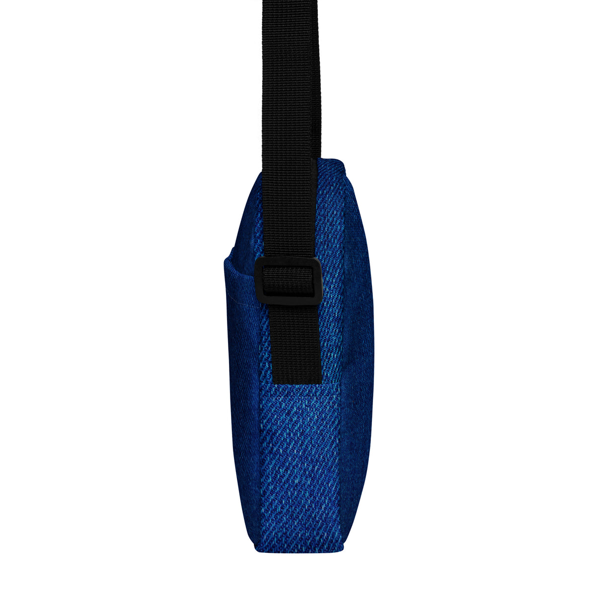 Denim crossbody bag, side profile showing the two-inch depth and strap buckle