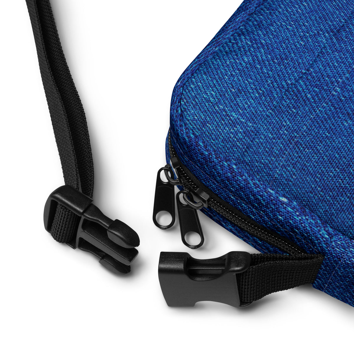 Close-up of the Denim crossbody bag strap clasp and adjustable webbing