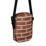 Brick crossbody bag, angled front view showing the zipper and outer pocket