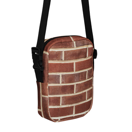 Brick crossbody bag, angled front view showing the zipper and outer pocket
