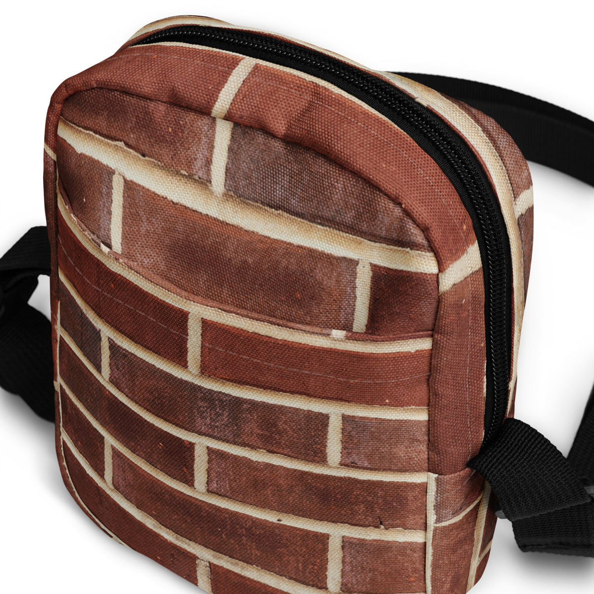 Close-up of the Brick crossbody bag corner stitching and zipper edge
