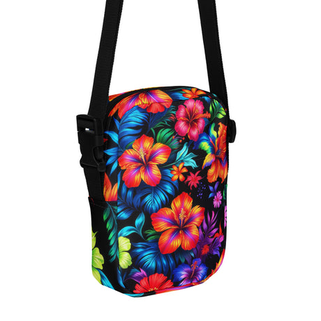 Neon Floral crossbody bag, angled front view showing the zipper and outer pocket